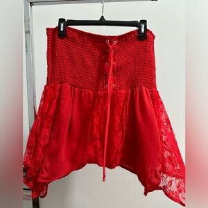 Red tank top from Venus . Striped tie at waist Top from Catos